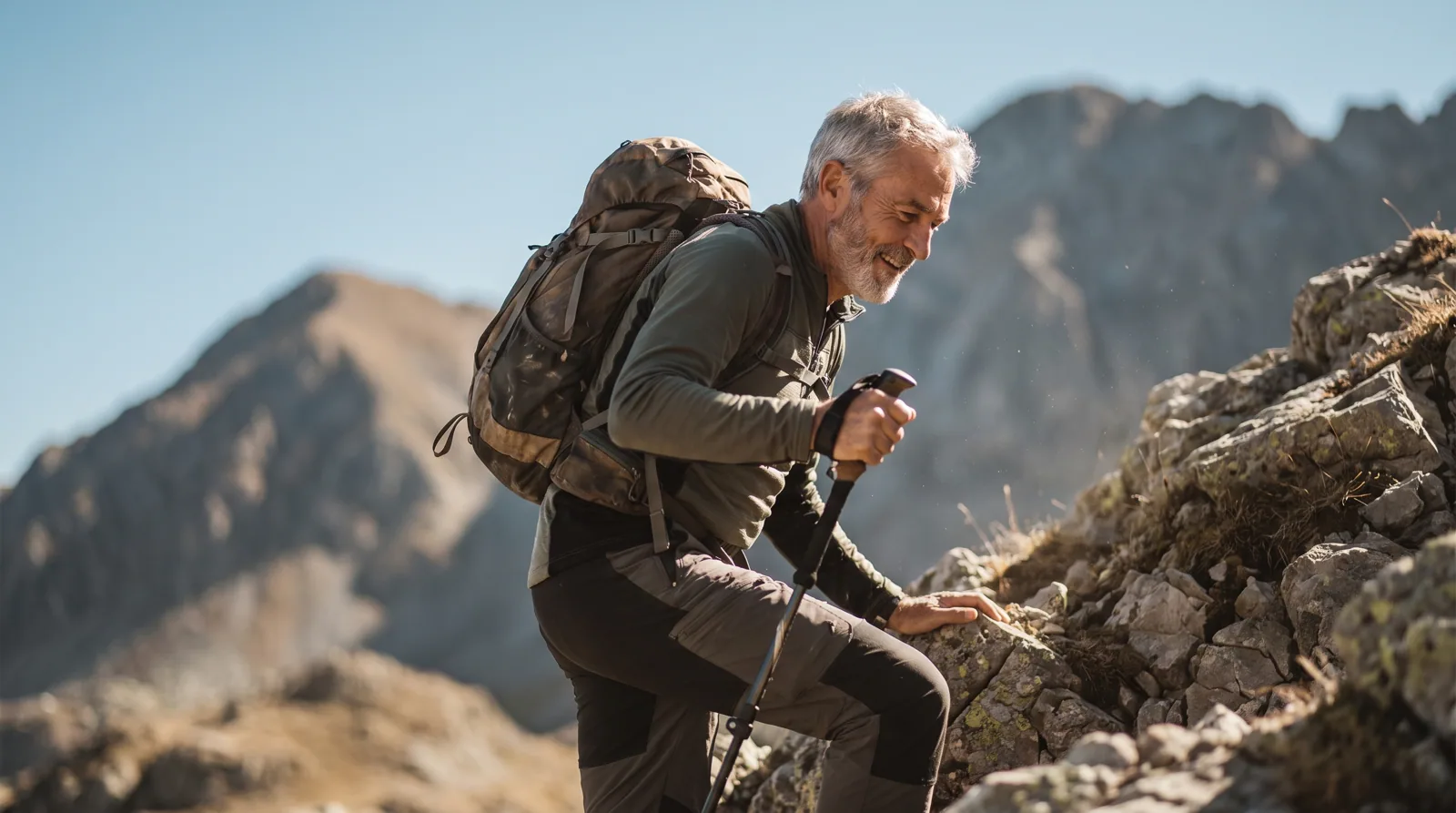 Man hiking uphill on a rocky trail